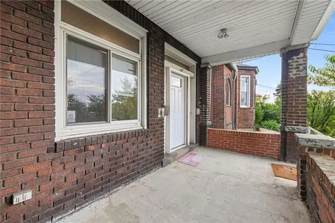 a view of entrance with stairs and wooden floor