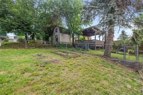 a backyard of a house with lots of green space