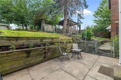 a view of a chairs and table in the patio