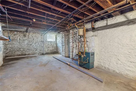 a view of an empty room with wooden walls