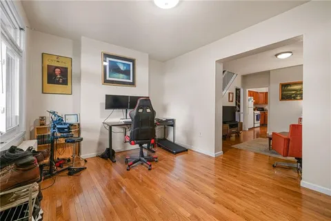 a view of a workspace with furniture and a bedroom