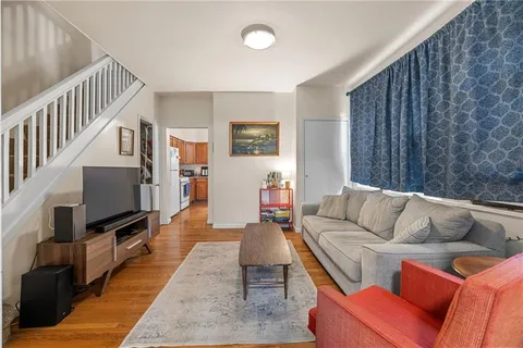 a living room with furniture fireplace and a flat screen tv