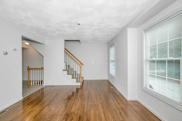 a view of entryway with wooden floor