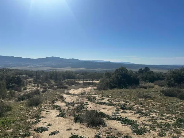a view of a lake with mountains in the background