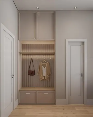 a view of a hallway with wooden floor and cabinet