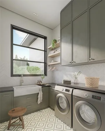 a utility room with sink dryer and washer