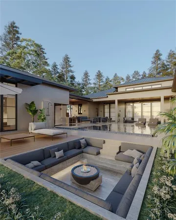 a view of house with swimming pool and furniture