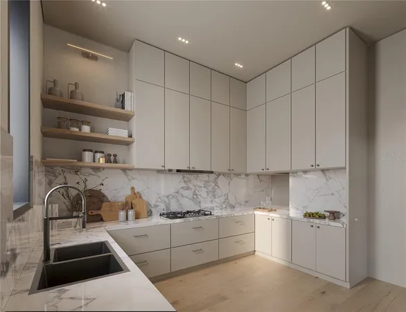 a kitchen with stainless steel appliances granite countertop a sink stove and cabinets
