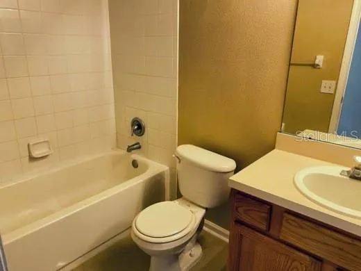 a bathroom with a sink toilet and mirror