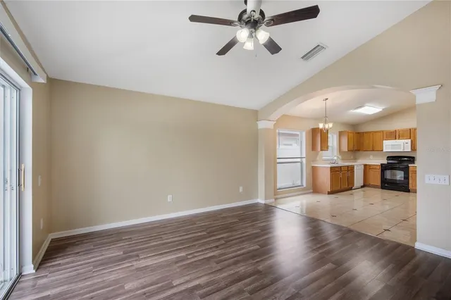 a view of a kitchen with a sink and a window