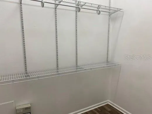 a view of a room with rack on the wall