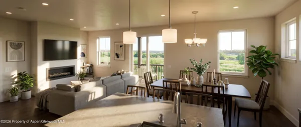 a living room with furniture a flat screen tv and a large window