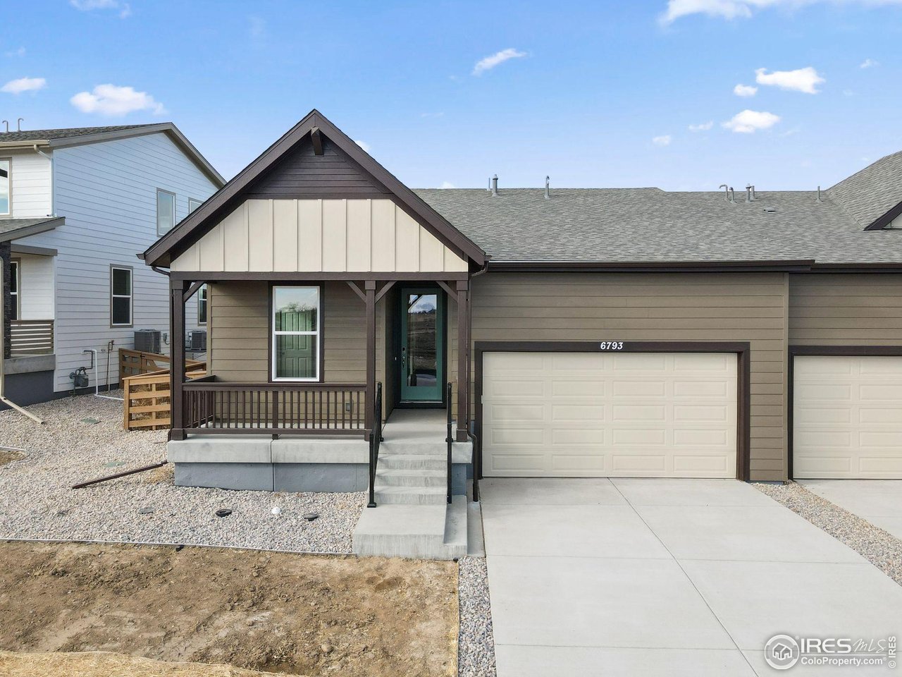 6793 Utica Court Firestone, CO 80504 - Photo 1 of 26 a front view of a house with garden