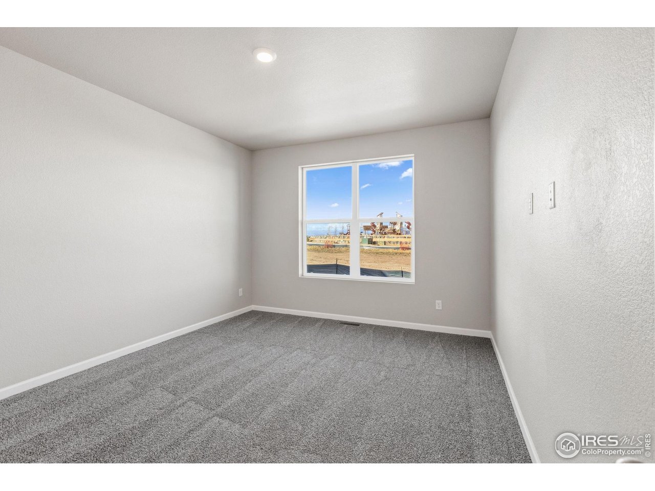 6793 Utica Court Firestone, CO 80504 - Photo 14 of 26 a view of an empty room and window