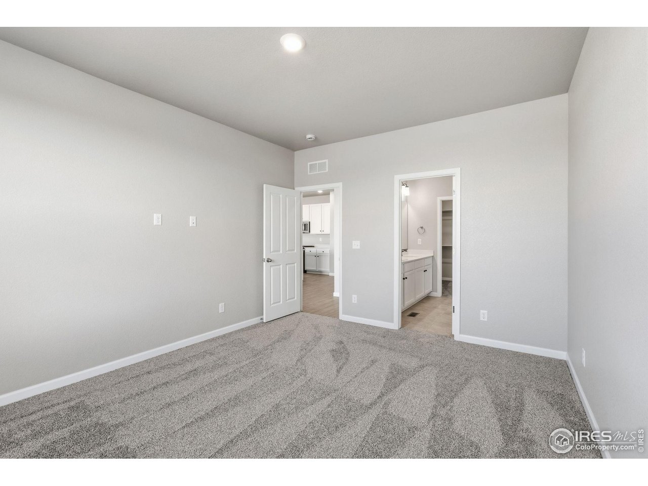 6793 Utica Court Firestone, CO 80504 - Photo 15 of 26 a view of an empty room with wooden floor