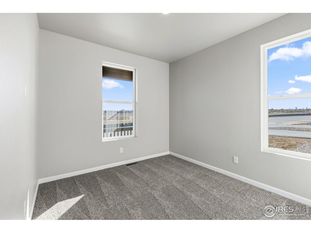 6793 Utica Court Firestone, CO 80504 - Photo 19 of 26 a view of an empty room with a window