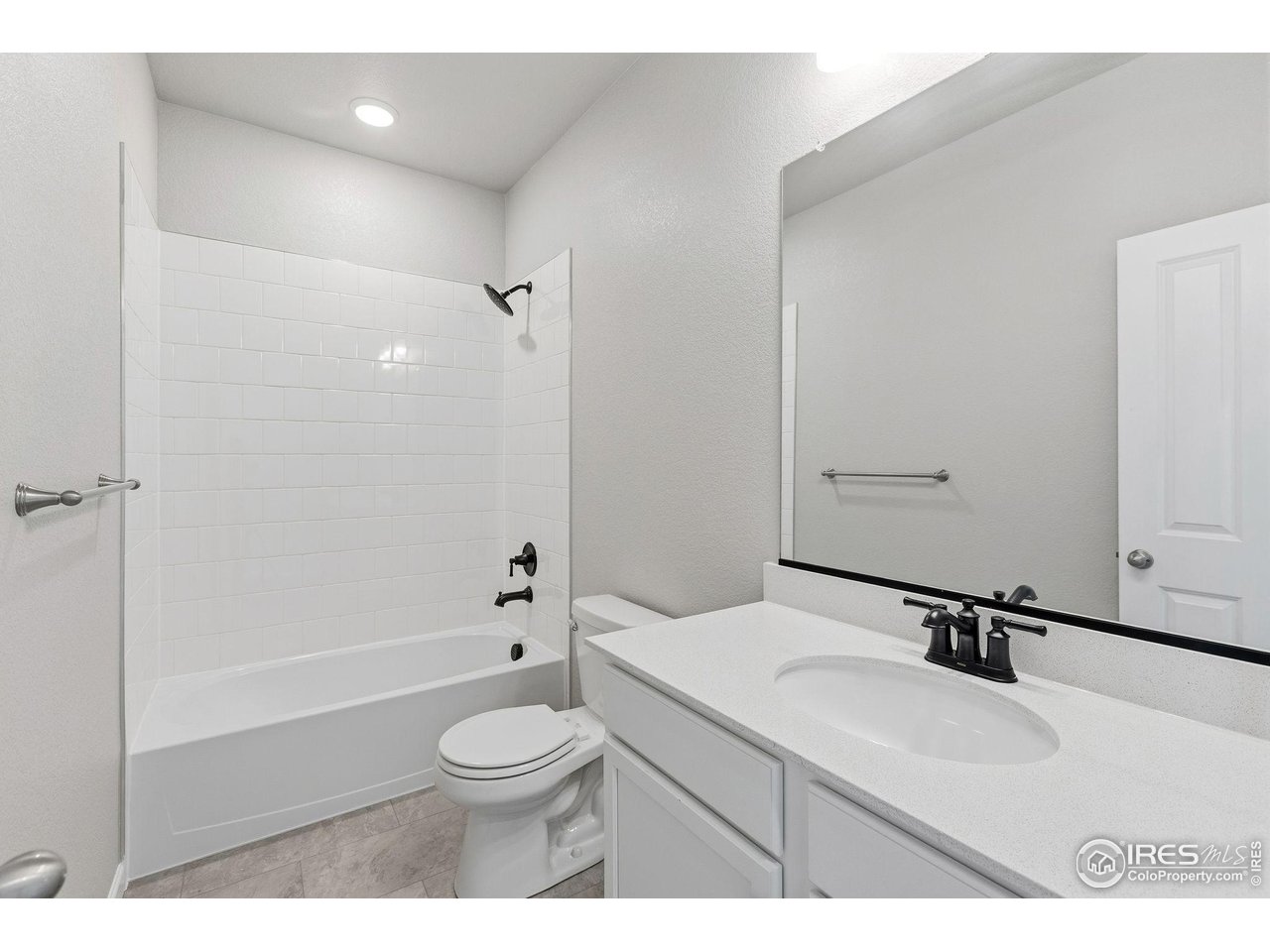 6793 Utica Court Firestone, CO 80504 - Photo 21 of 26 a bathroom with a sink toilet a shower and a mirror