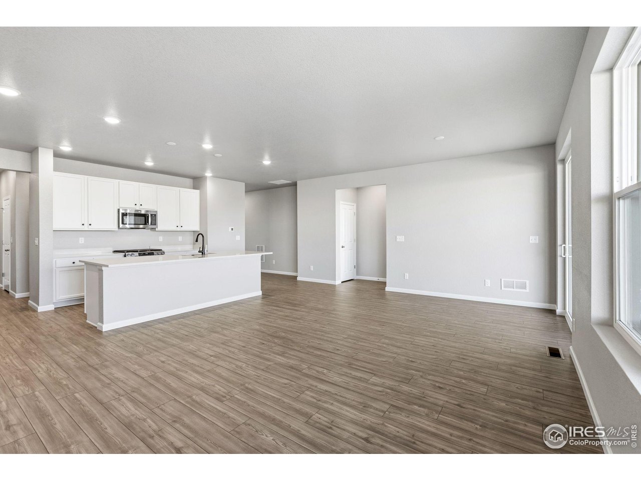 6793 Utica Court Firestone, CO 80504 - Photo 9 of 26 a view of kitchen with wooden floor