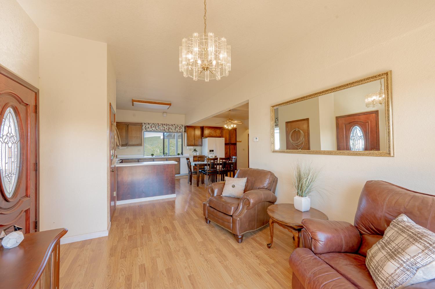 5912 Old Gulch Road San Andreas, CA 95249 - Photo 7 of 71 a living room with furniture and a chandelier