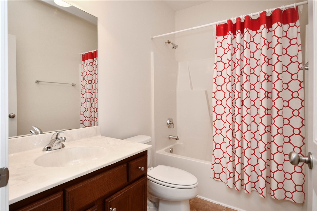 47 Hillsborough Drive Anderson, SC 29621 - Photo 17 of 23 This bright bathroom features a vanity, mirror, and a shower-tub combination.
