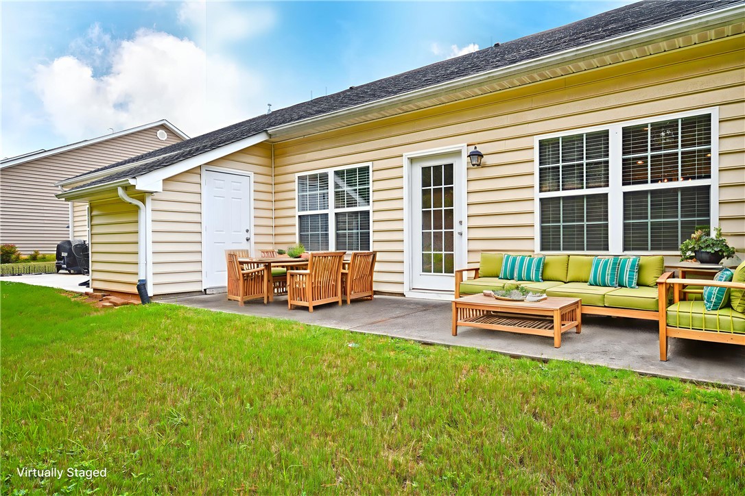 47 Hillsborough Drive Anderson, SC 29621 - Photo 19 of 23 This inviting patio offers a seamless transition to a private yard, perfect for outdoor enjoyment.