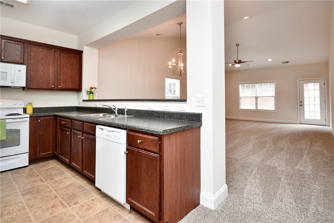47 Hillsborough Drive Anderson, SC 29621 - Photo 3 of 23 This open-concept layout features a well-appointed kitchen flowing into a comfortable living area.