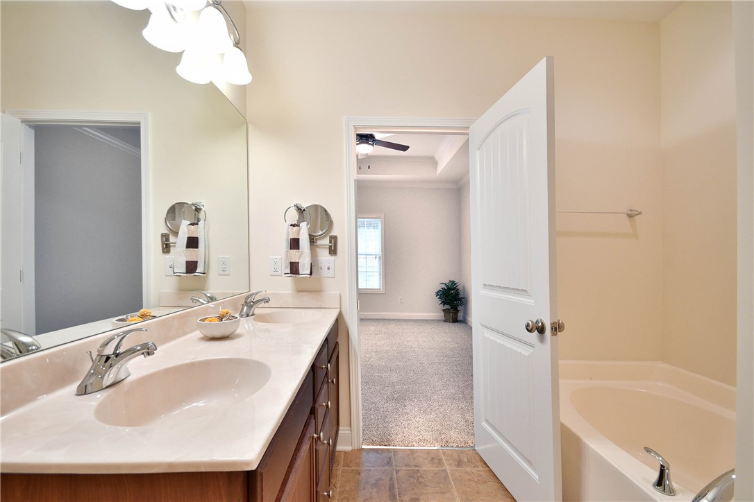 47 Hillsborough Drive Anderson, SC 29621 - Photo 10 of 23 This spacious bathroom offers dual vanities and a relaxing soaking tub.