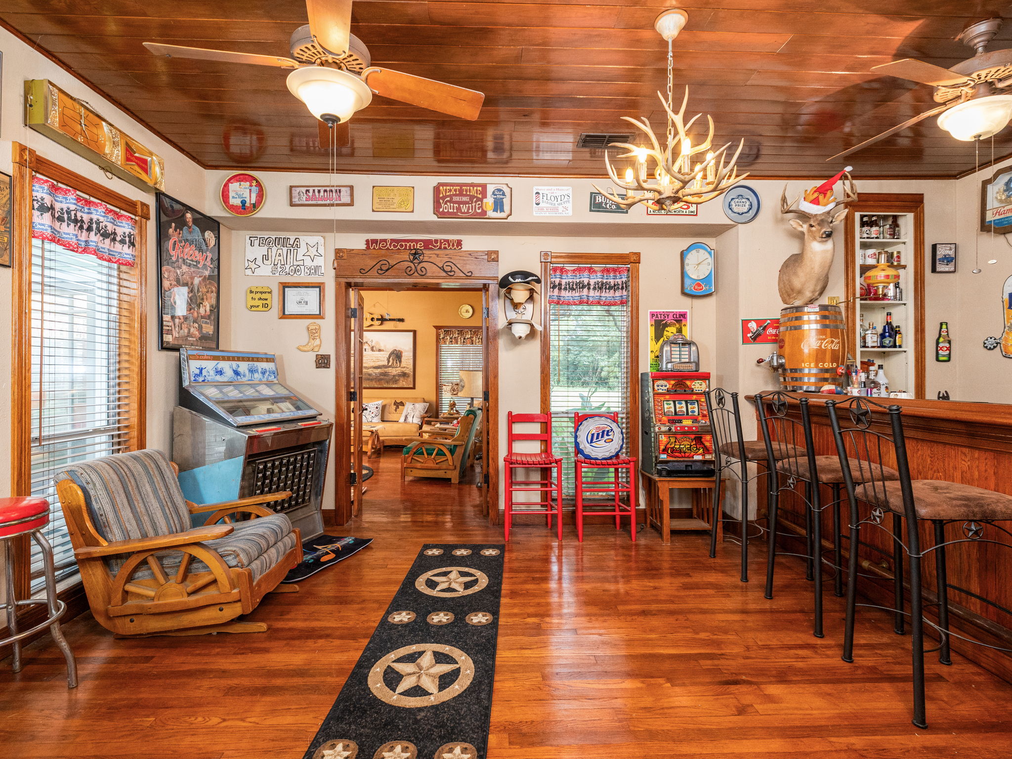 1065 Private Road 7041 Elgin, TX 78621 - Photo 13 of 38 This one-of-a-kind room showcases exceptional craftsmanship and thoughtful detail from floor to ceiling. Featuring stunning oak wood flooring and custom oak doors, this space is truly a must-see treasure