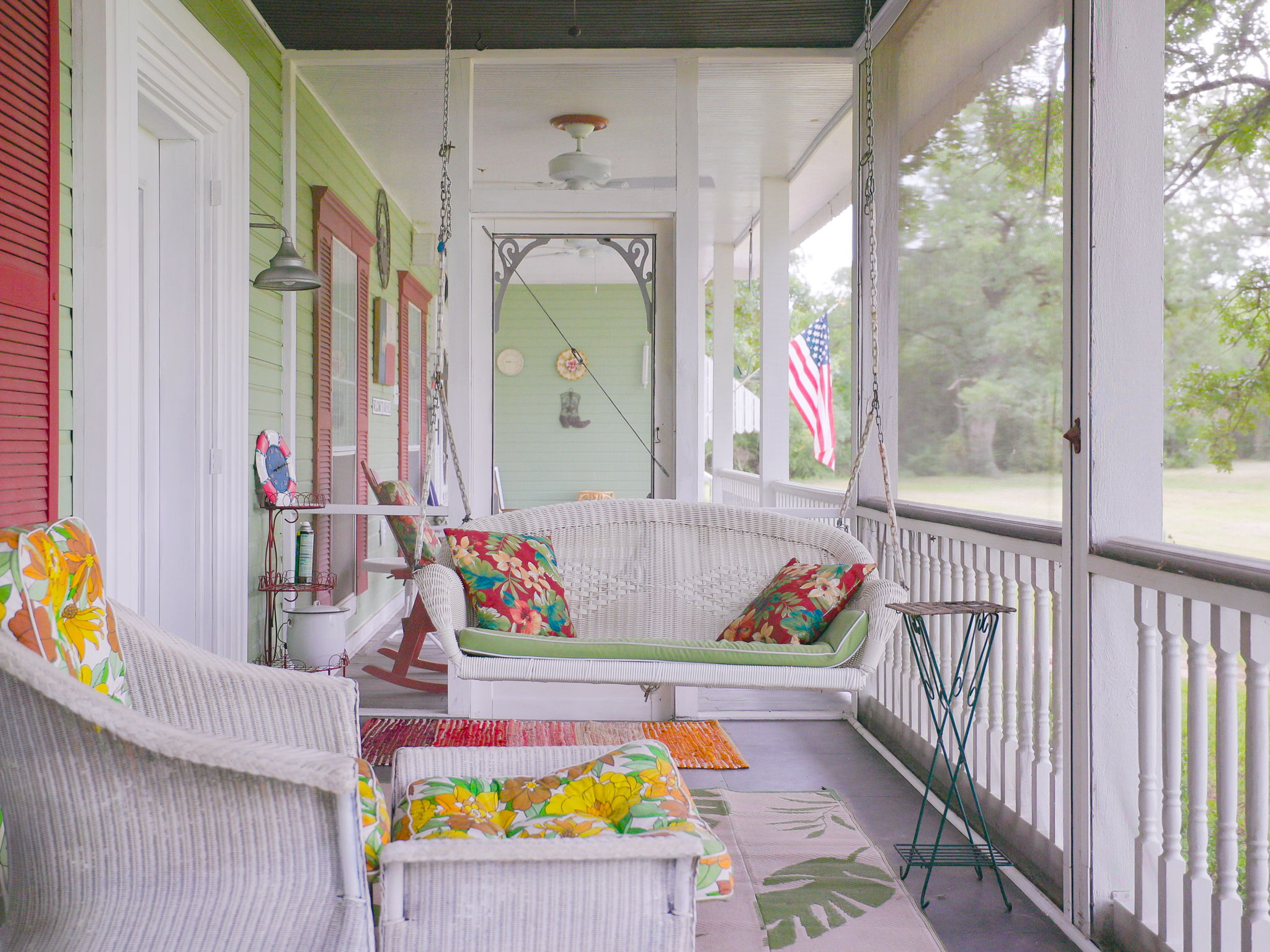 1065 Private Road 7041 Elgin, TX 78621 - Photo 3 of 38 Cozy screened porch, perfect for unwinding while watching stunning sunsets. The ceiling fan keeps the space comfortable on warm Texas evenings, making it an inviting spot to relax and enjoy the outdoors year-round