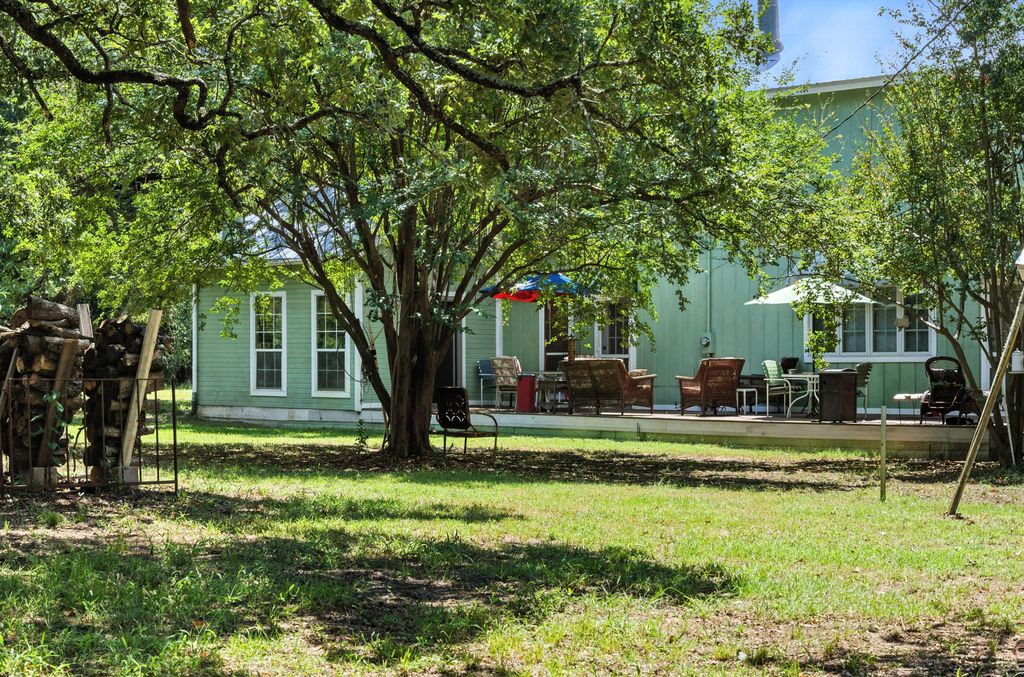 1065 Private Road 7041 Elgin, TX 78621 - Photo 35 of 38 View of back yard, peach trees