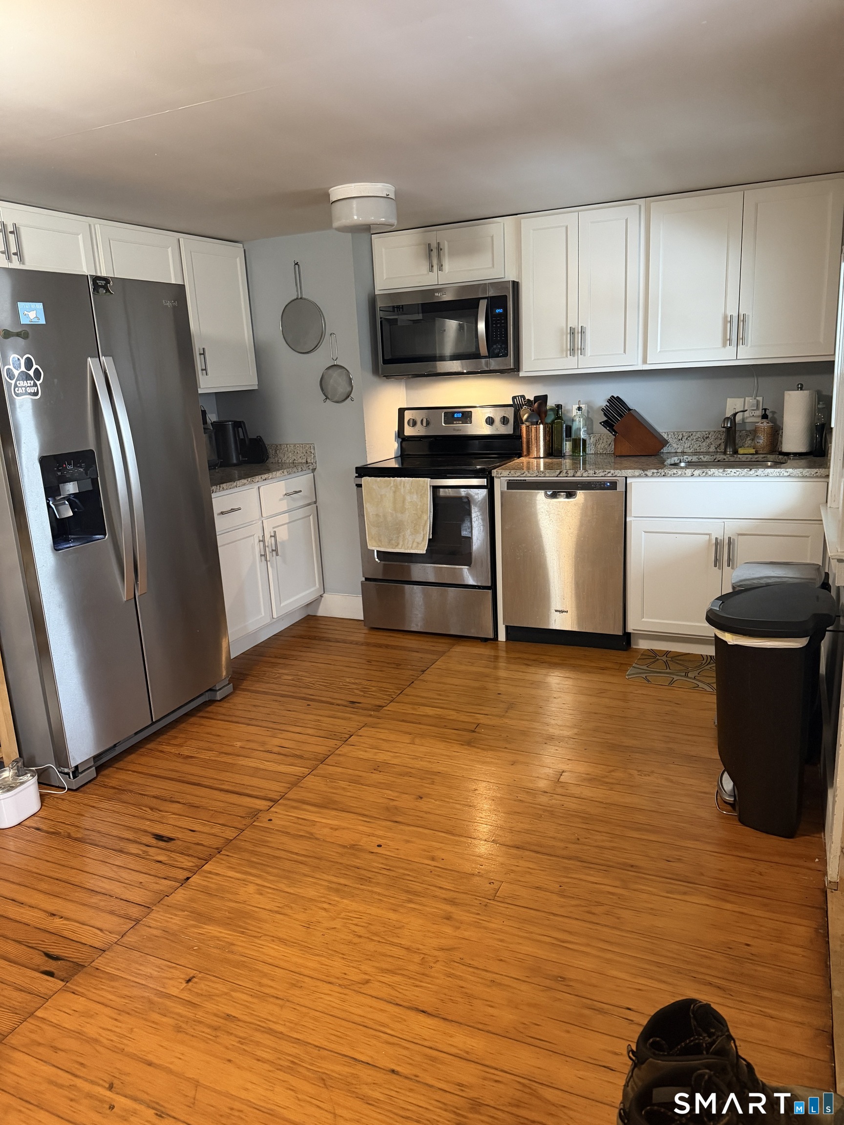 288 Benham Road Groton, CT 06340 - Photo 2 of 4 a kitchen with stainless steel appliances a refrigerator stove microwave and sink
