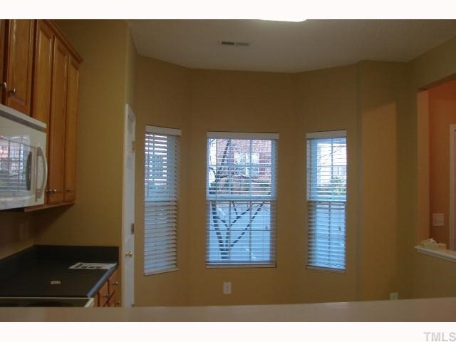 107 Galimore Way Apex, NC 27502 - Photo 3 of 12 a view of an empty room and window