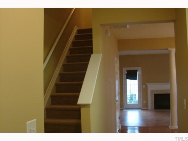 107 Galimore Way Apex, NC 27502 - Photo 4 of 12 a view of entryway and hall with wooden floor