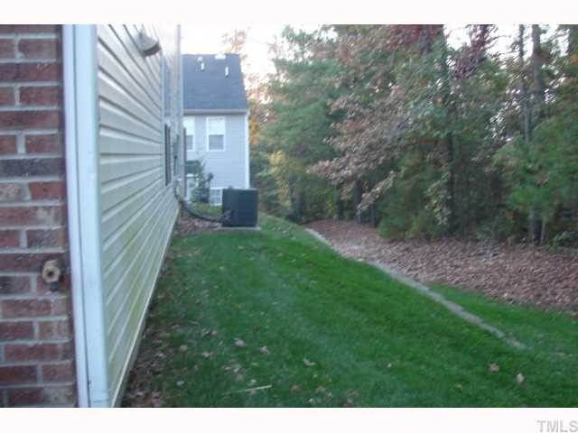 107 Galimore Way Apex, NC 27502 - Photo 8 of 12 a view of a back yard from a backyard
