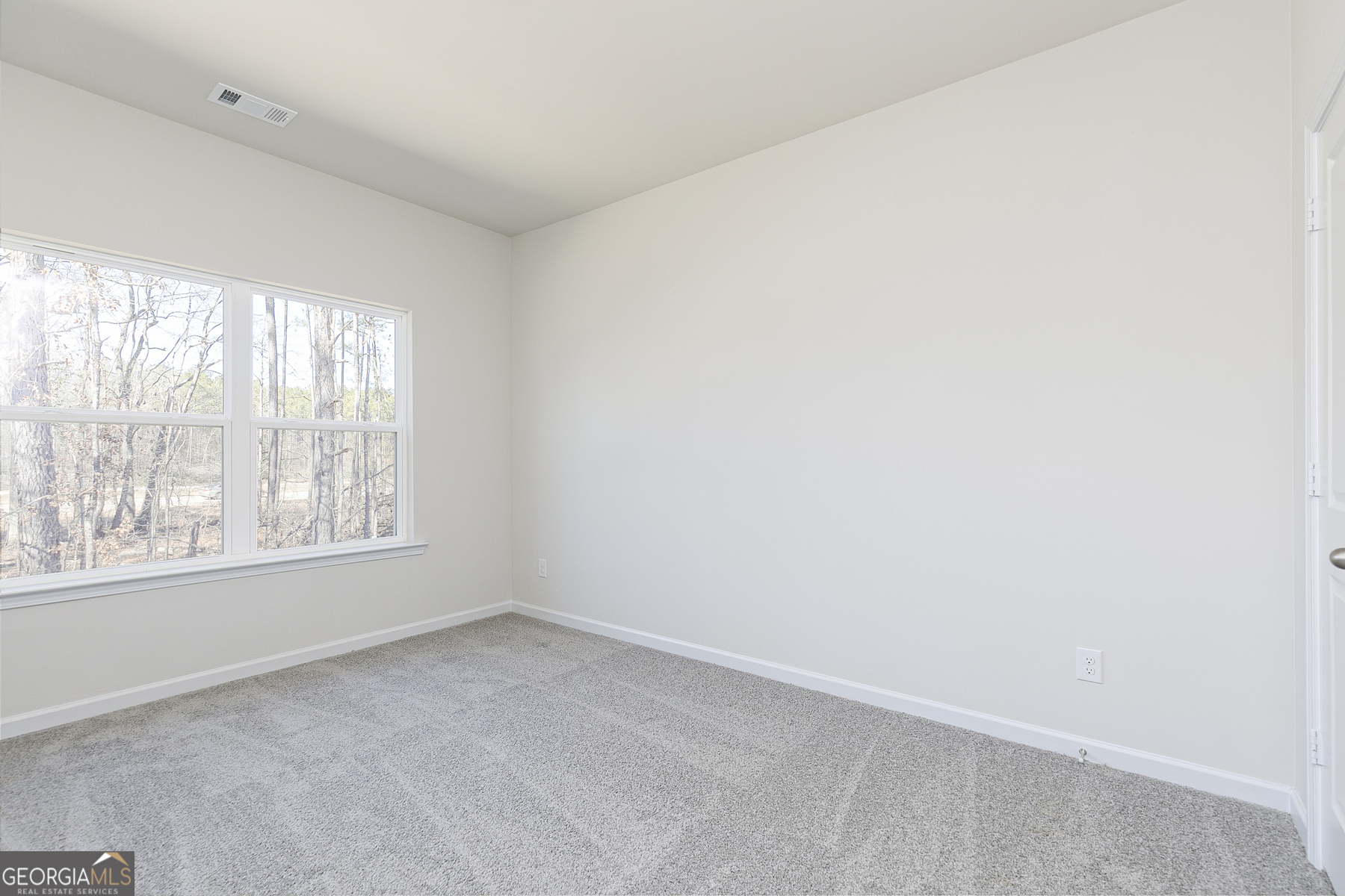 228 Rooker Drive LaGrange, GA 30241 - Photo 10 of 17 an empty room with a window