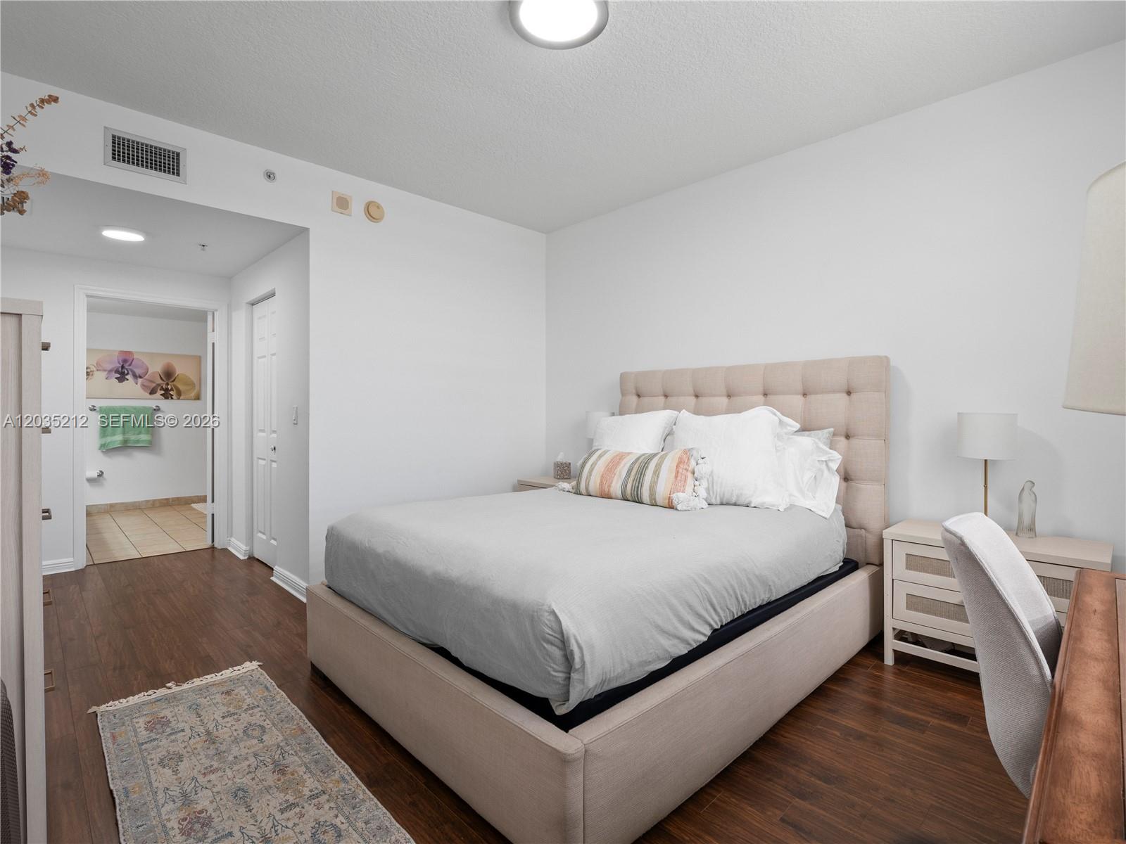 888 Douglas Road, Unit 302 Coral Gables, FL 33134 - Photo 19 of 51 MASTER BEDROOM WITH CUSTOM BUILT WALK-IN CLOSET