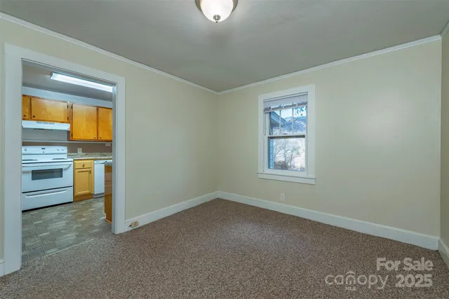 a view of a kitchen with a sink cabinets and a window