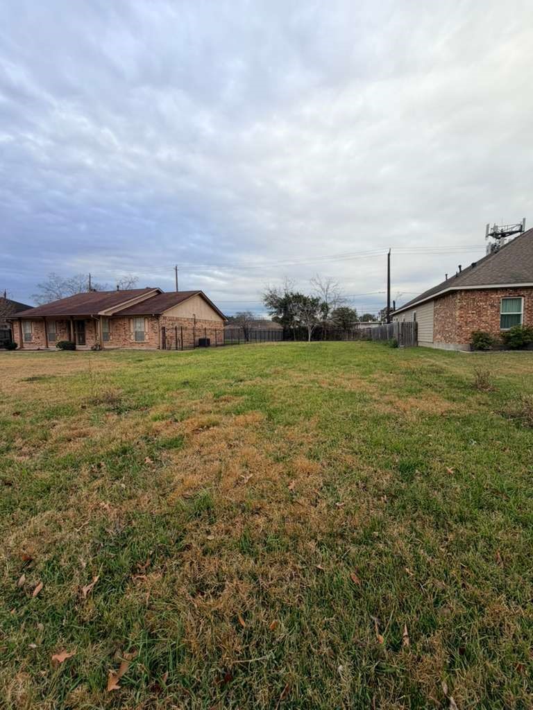 7135 Rook Boulevard Houston, TX 77087 - Photo 1 of 6 a view of a field with an buildings in the background