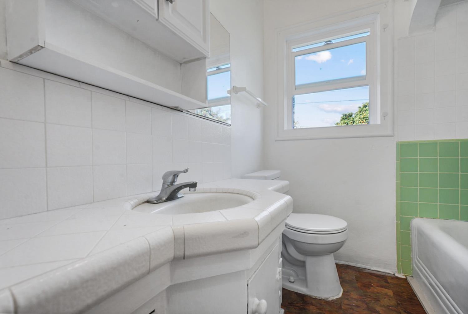 1899 Union Avenue Merced, CA 95340 - Photo 13 of 27 a bathroom with a sink and a toilet