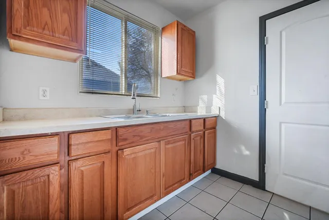 a kitchen with stainless steel appliances granite countertop a sink and cabinets