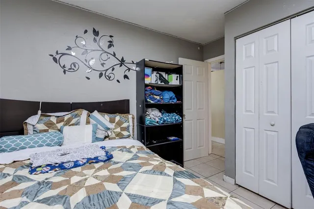 a bedroom with a bed and walk in closet