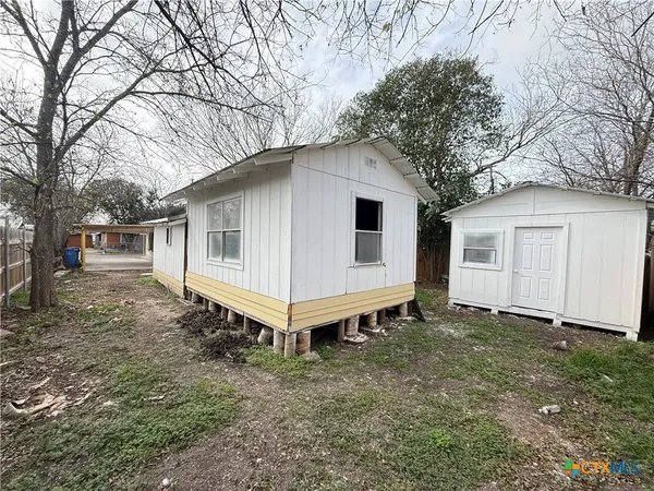 a view of an empty room with a fireplace