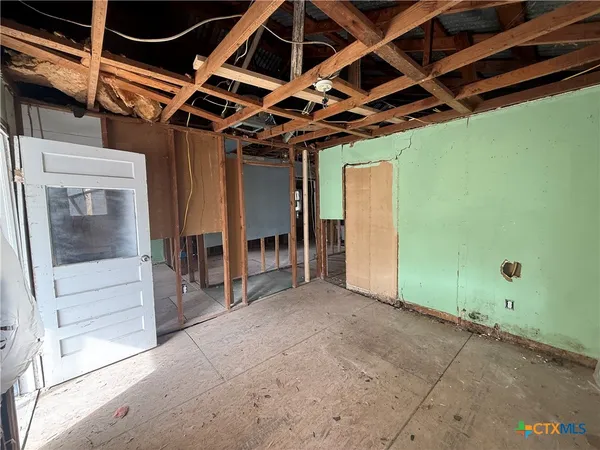 a view of livingroom with hardwood floor and hallway