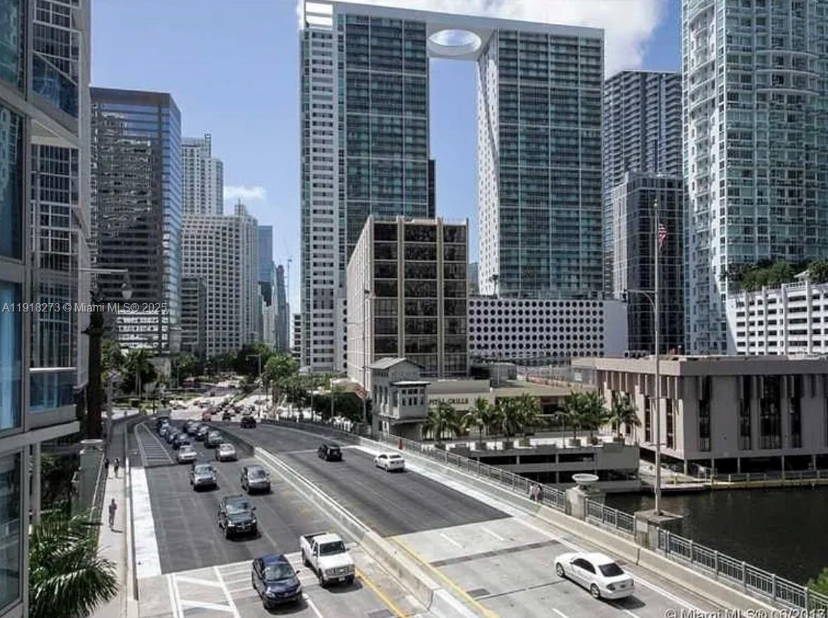 a city street filled with lots of tall buildings