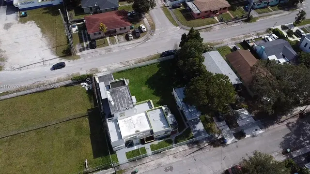 an aerial view of a house with outdoor space