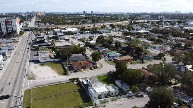 an aerial view of a house with a lake view