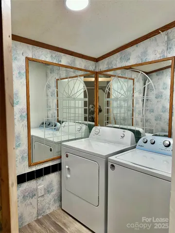 a large kitchen with stainless steel appliances granite countertop a sink and a stove