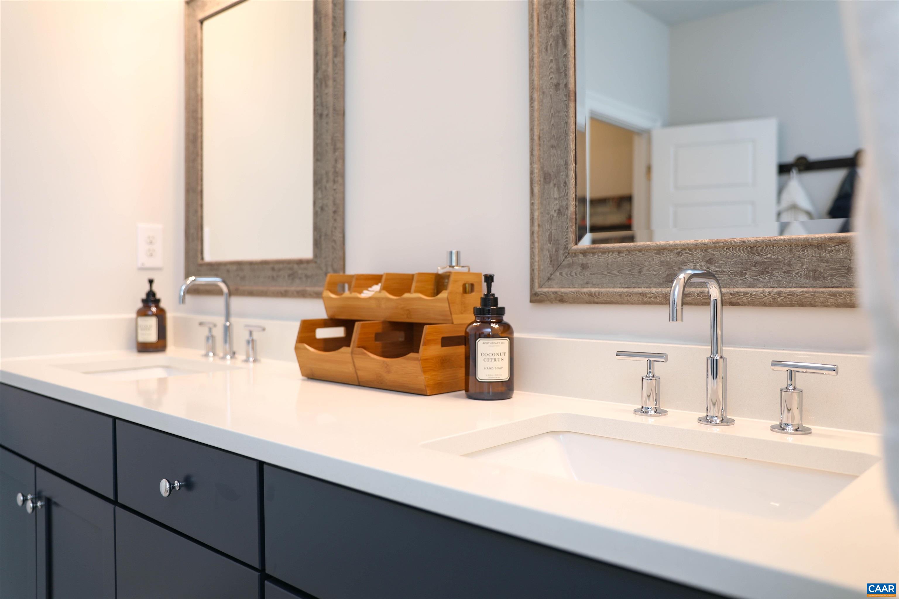 2483 Ferndown Lane Keswick, VA 22947 - Photo 28 of 54 a bathroom with a sink and a mirror