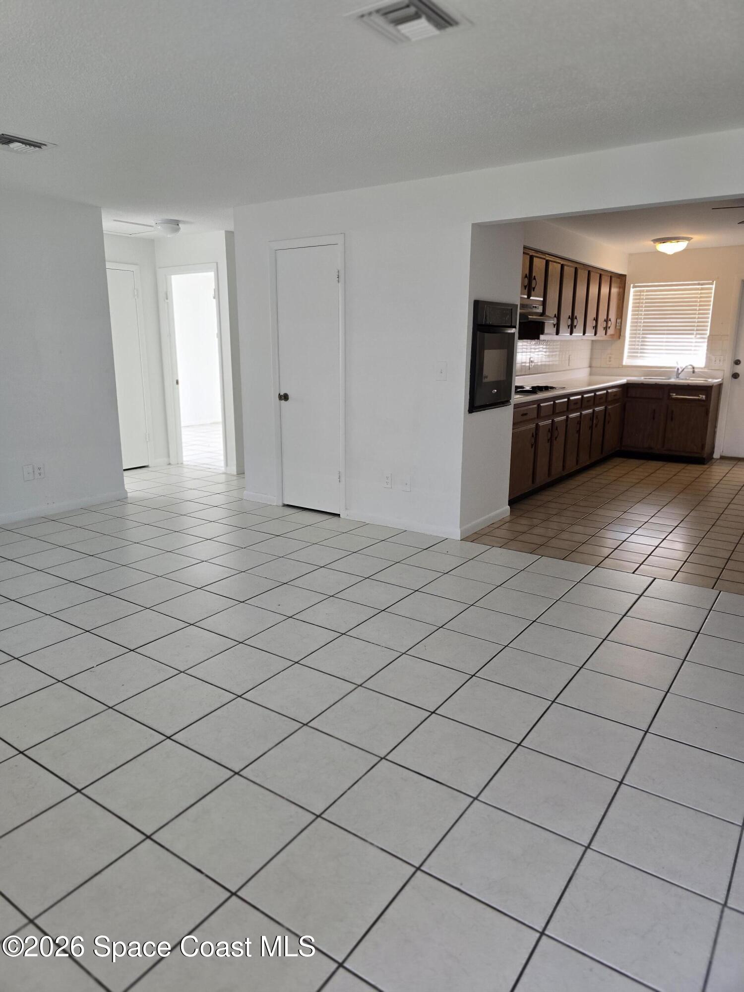 95 Lucas Road Merritt Island, FL 32953 - Photo 2 of 7 a view of an empty room and window