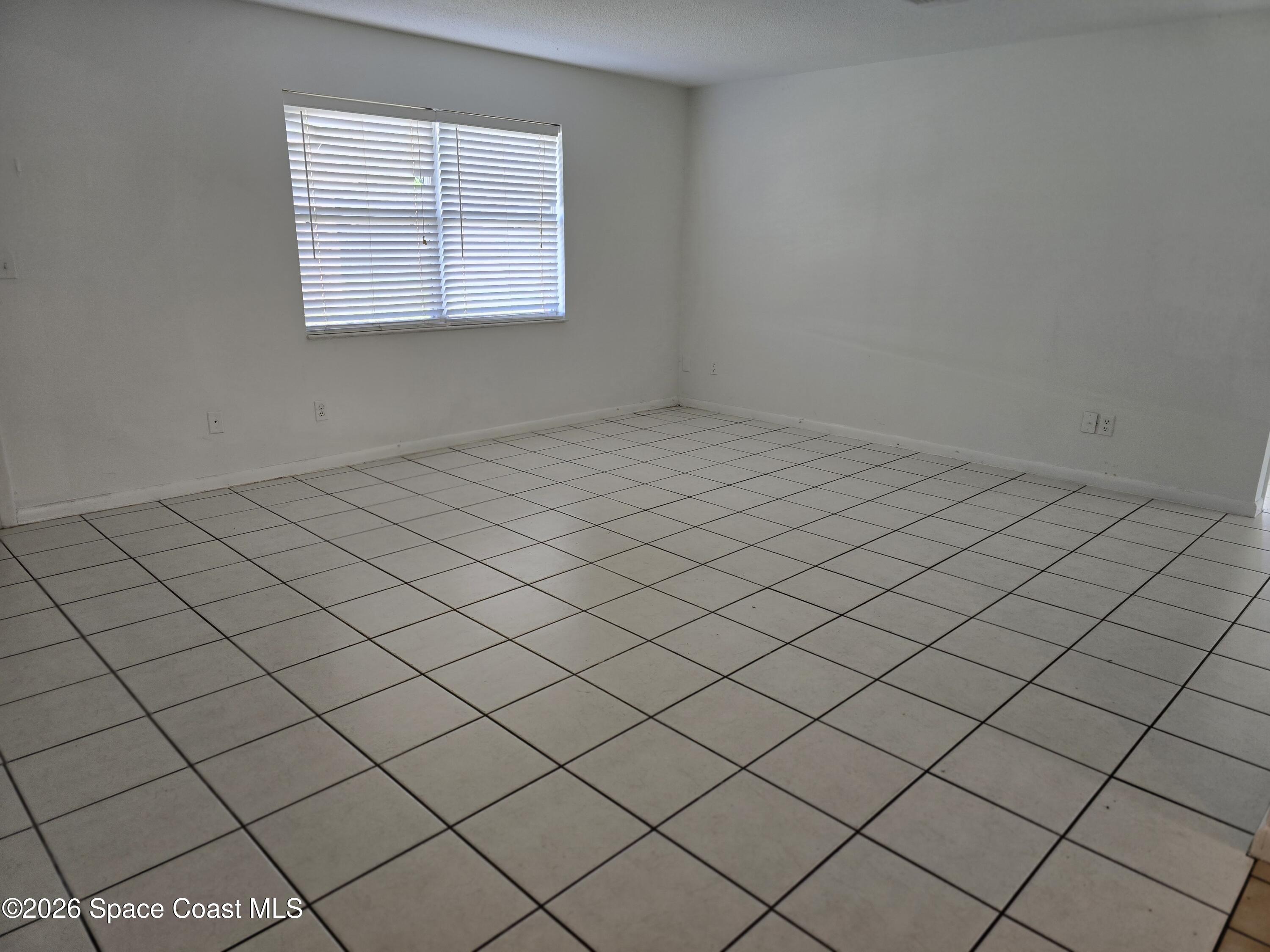 95 Lucas Road Merritt Island, FL 32953 - Photo 3 of 7 a view of a room and window
